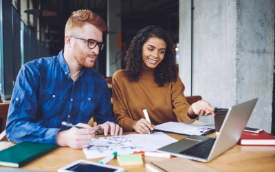 Colleagues discuss the best strategy for improving CTAs for their email marketing